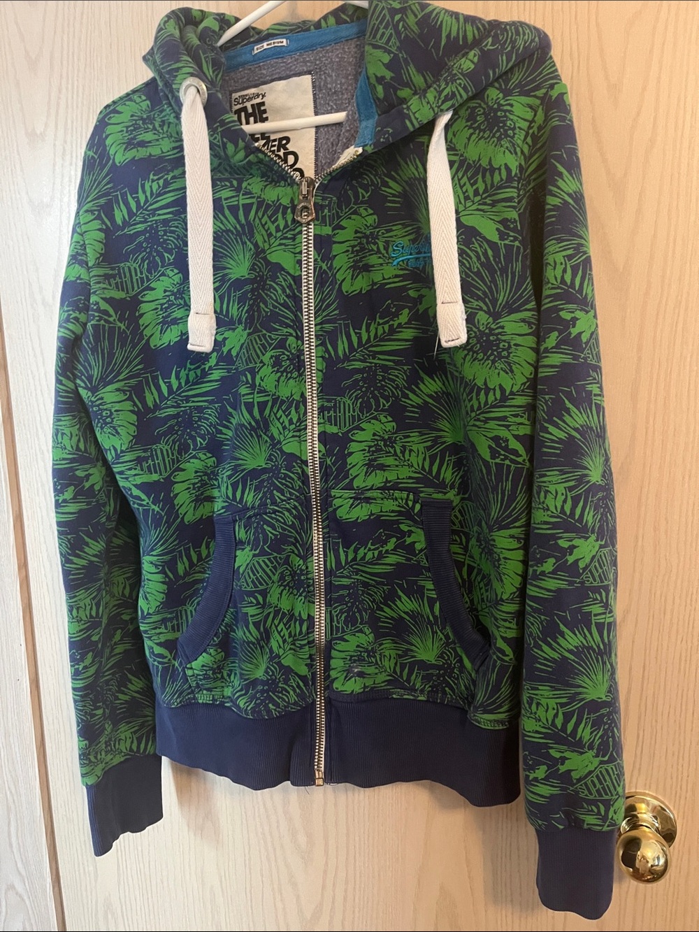 Superdry Navy Hoodie with Green Tropical Print and White Drawstrings